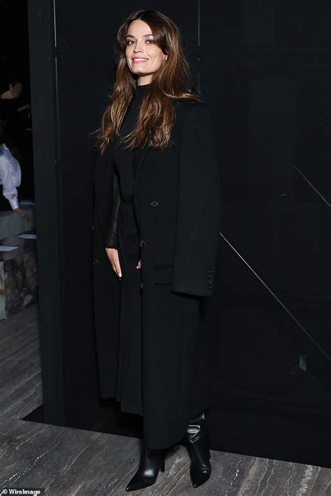 Emma Mackey goes BRALESS at the Saint Laurent show during。